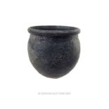 A Roman, small, dark-coloured, earthenware beaker/cup