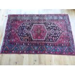 A mid 20th century Persian woollen rug