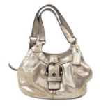 A shimmering, gold-coloured leather handbag by 'Coach'