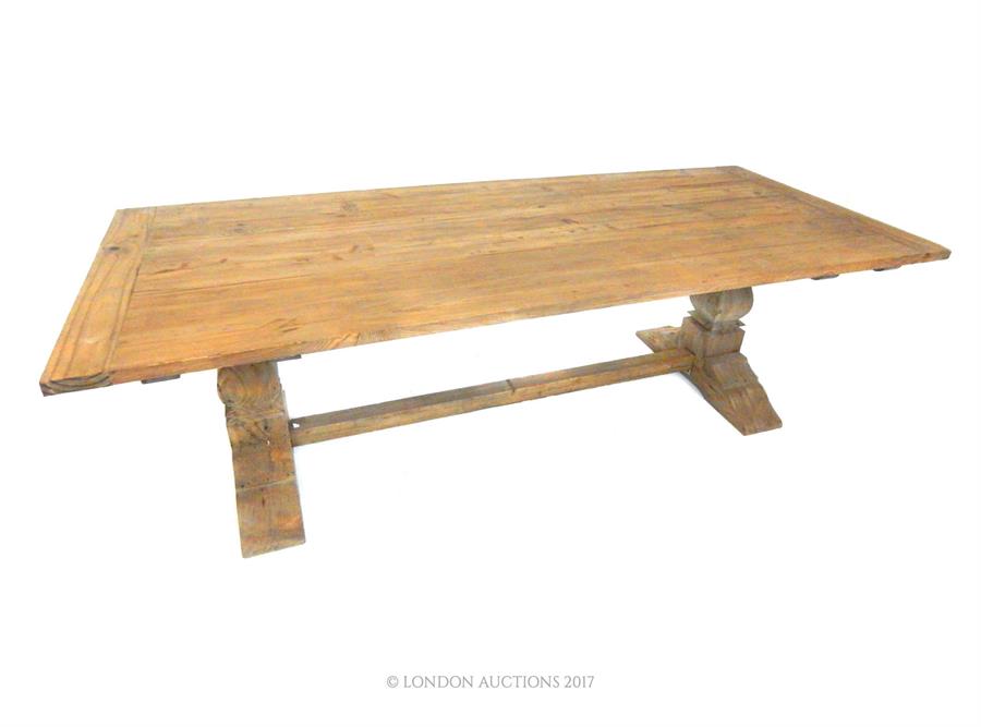 A large pine plank top refectory table