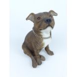 A large, decorative, painted, resin, seated Staffordshire bull terrier