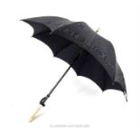 An early 20th century, black silk-satin Edwardian umbrella with fine Burmese Carved Ivory Handle,