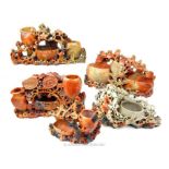 Five oriental soapstone posie holders of different styles and sizes.