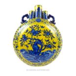 A Chinese, moon-flask, allover decorated in blue on a yellow ground