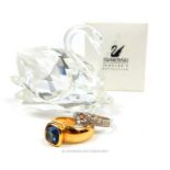 Two Swarovski rings together with a Swarovski crystal swan