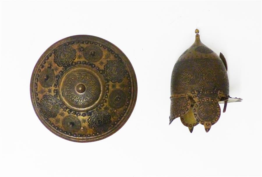 A 19th century Ottoman style Helmet with folding side protectors and shield; both heavily engraved.