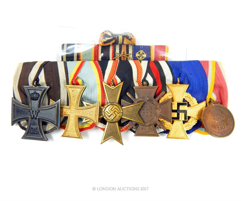 A group of six German medals including: Iron Cross 1914 second class; Military Merit Cross 1914;