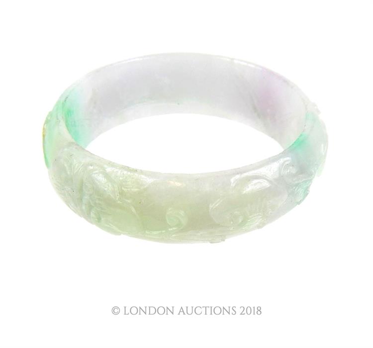 A carved Chinese jade bangle - Image 2 of 2