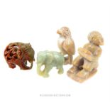 A collection of four, hand-carved, soapstone figurines