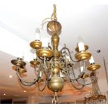 A brass 12 branched chandelier; fitted for electricity; 70cm high.