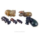 A collection of carved ebony and soapstone hippopotamuses