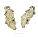 A pair of composite stone crocodiles; each 93cm long.