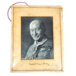 A photographic portrait of Robert Baden-Powell, signed "Baden Powell of Gilwell"