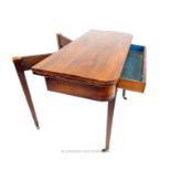 A mahogany veneer tea table; raised upon castors; a/f.