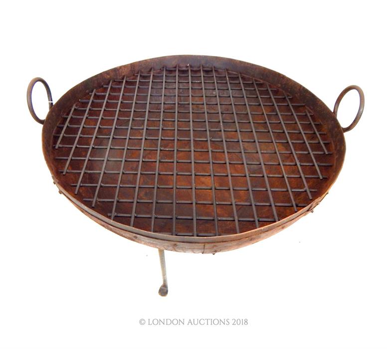 A cast metal indian fire pit grate; 81cm diameter. - Image 2 of 2