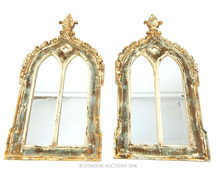 A pair of mirrors with distressed frames; overall size 117cm x 60cm.
