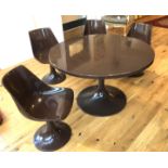 A Modernist Finnish Asko Amigo brown circular fibreglass table and chairs