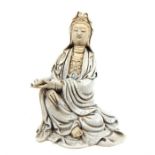 A Guanyin crackle glazed figurine; 22cm high; with four character mark.