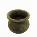 A Roman, dark-coloured, earthenware vessel