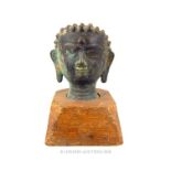 A late 19th century Nepalese bronze Buddha head