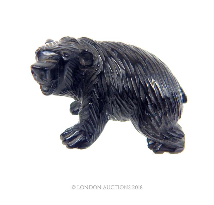 A vintage, carved, obsidian bear