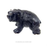 A vintage, carved, obsidian bear