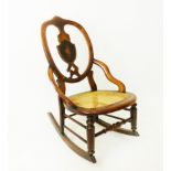 A turn of the last century fruitwood nursing rocking chair