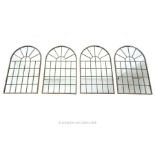 Four arch topped garden mirrors.