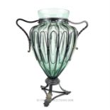 A very large, decorative, green glass and wrought iron mounted vase