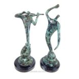 Two bronzed cast abstract figurines.