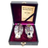 A boxed pair of white metal and hand-cut, lead crystal pepper mill and shaker set