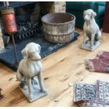 A pair of stone ware seated hounds; each 72cm high.