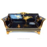 A small 20th century Chinese black lacquered two seater sofa