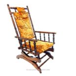 An early 20th century American turned fruitwood rocking chair