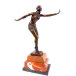 After Chiparus, an Art Nouveau style bronzed metal figurine of a female dancer; raised upon a marble