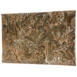 A deeply-carved, vintage, wooden panel from Cameroon