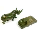 A green hard-stone carved rhino sculpture and similar hard-stone ashtray