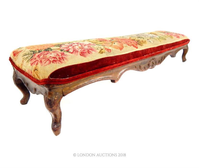 A 19th century, long upholstered foot stool; 116cm wide.
