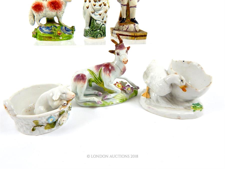 A collection of various ceramic pieces: Staffordshire style goat together with other figurines; - Image 3 of 3