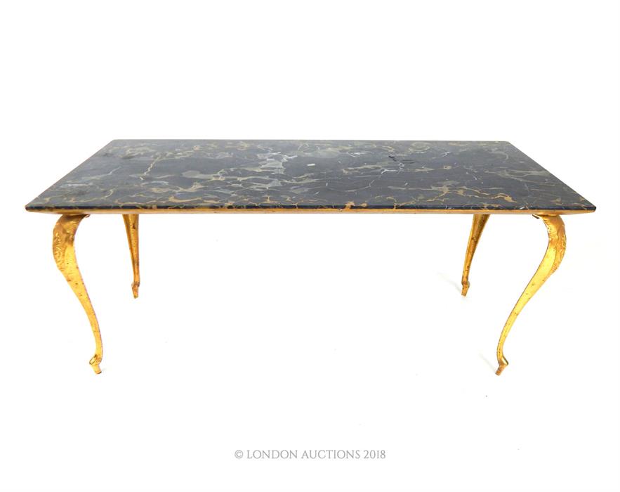 An elegant, gilt metal and black-veined marble coffee table