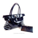 A 'Hobbs' black-patent leather handbag with a Louis Vuitton-style wallet