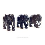 A set of three mid 20th century ebony models of Asian elephants