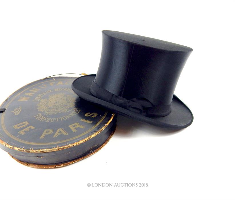 A 19th century, black silk, folding, top hat in original, Parisian retailer's box