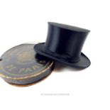 A 19th century, black silk, folding, top hat in original, Parisian retailer's box