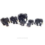 A collection of seven mid 20th century ebony Asian elephants