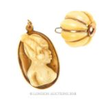 Two, 18 ct yellow gold and bone, vintage, West African, pendants