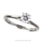 A 14 ct white gold, diamond solitaire ring (1/2 carat)