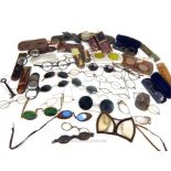 A large collection of antique spectacles