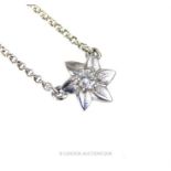 A 14 ct white gold and diamond, flower-head necklace