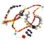 A collection of antique, colourful, Persian beads on four strings